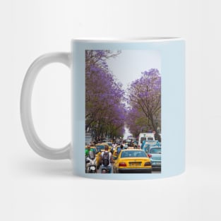 Greece. Athens. Busy street of Jacaranda trees. Mug